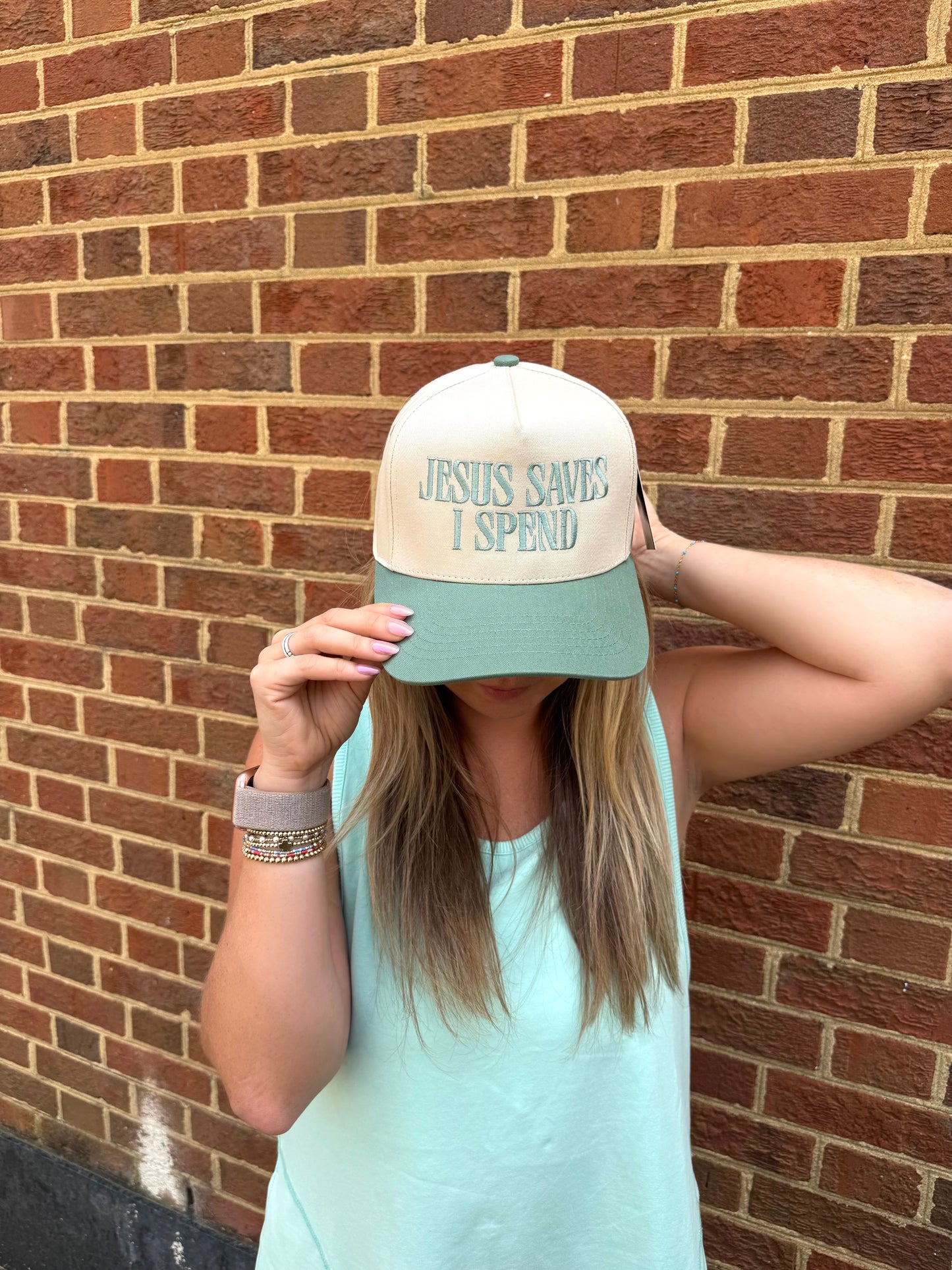 "Jesus Saves, I Spend" Trucker Hat in Sage Green
